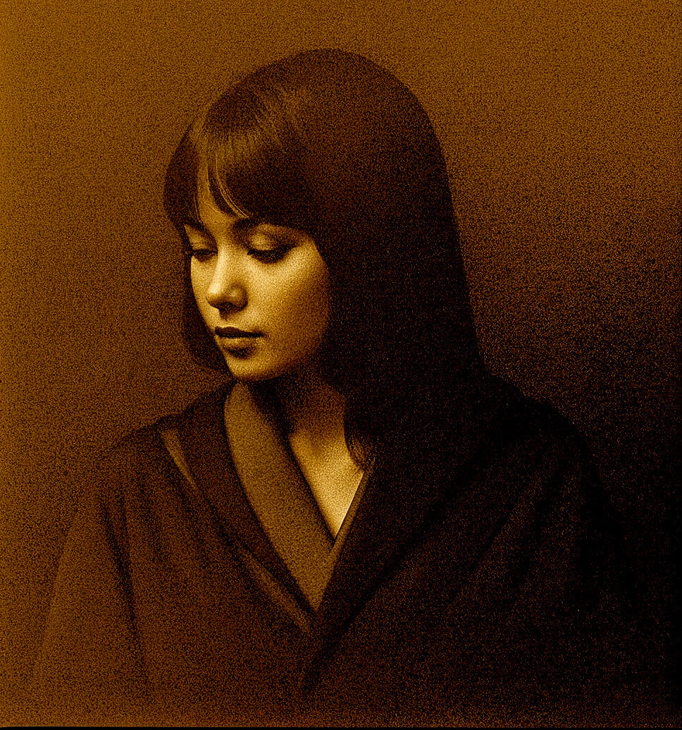 Contemplative Young Woman in Elegant Draped Garment