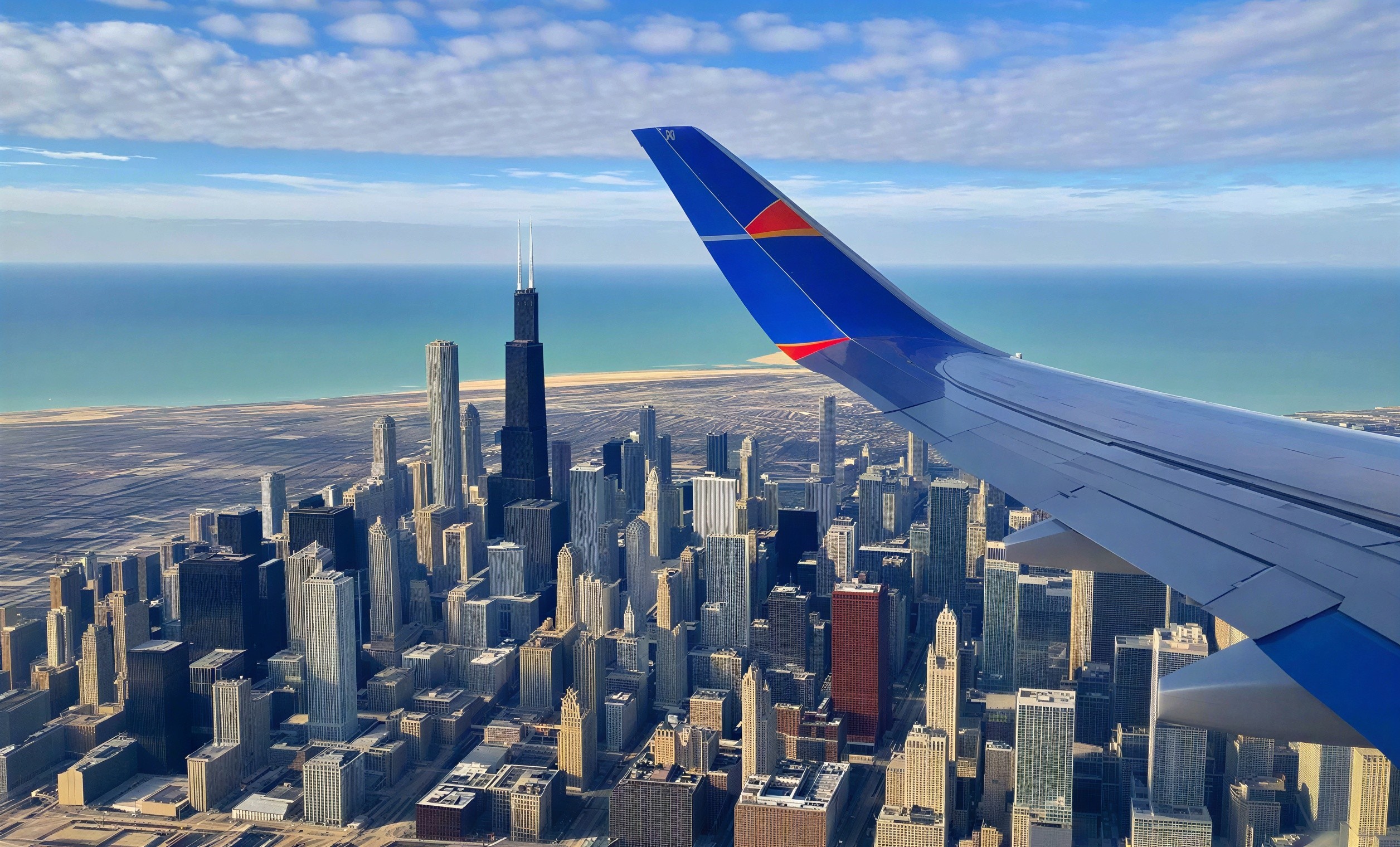 Aerial View of a Bustling City with Aircraft Wing