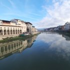 Serene Riverside Scene with Quaint Buildings and Nature