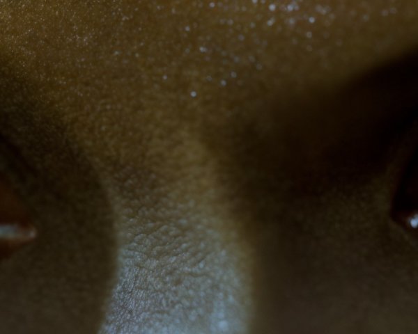 Close-Up of Contrasting Green and Brown Eyes