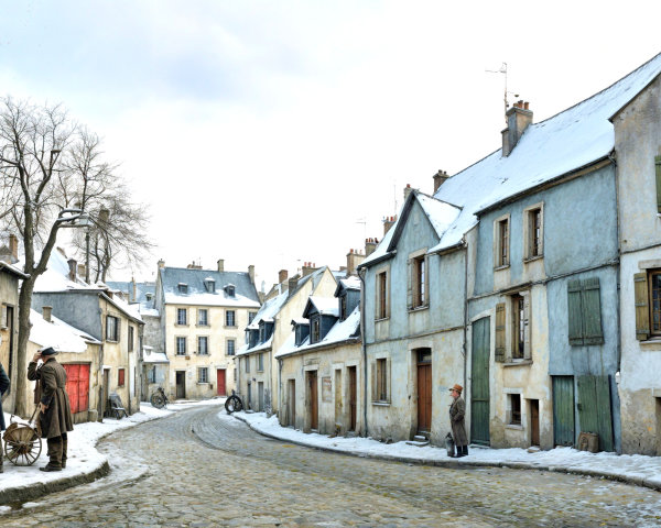 Snow-Covered Historic Village Street with Pastel Buildings