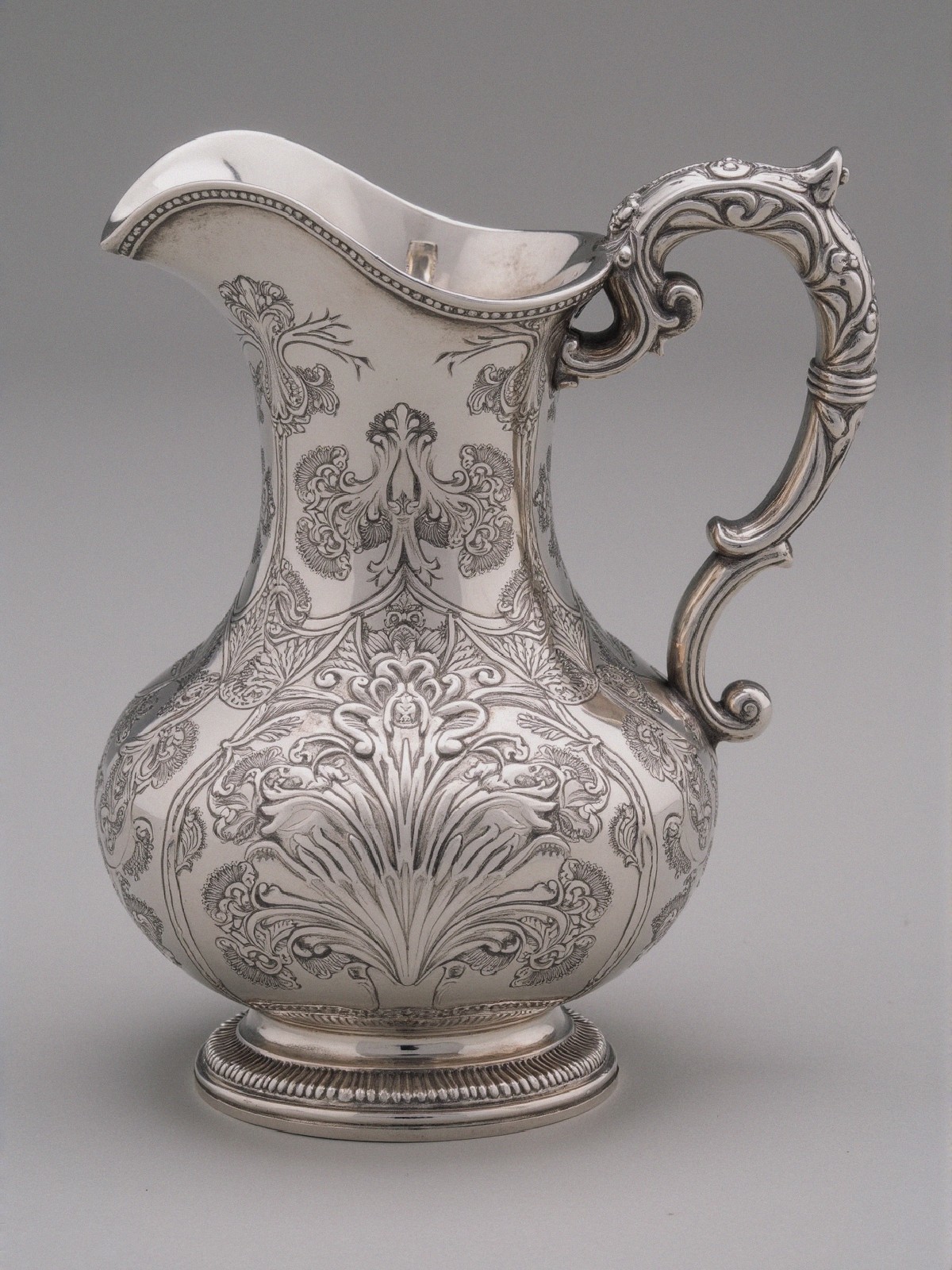 Elegant Silver Pitcher with Floral Engravings