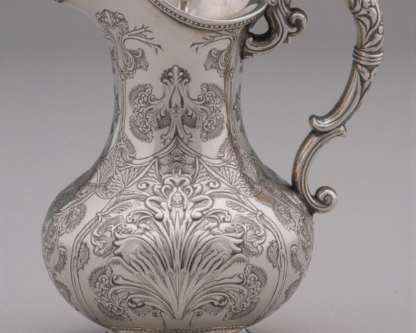 Elegant Silver Pitcher with Floral Engravings