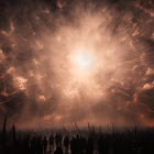 Silhouetted Crowd Against Luminous Sky at Night