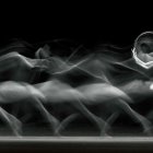 Graceful Dance in White Gown: Black-and-White Photo