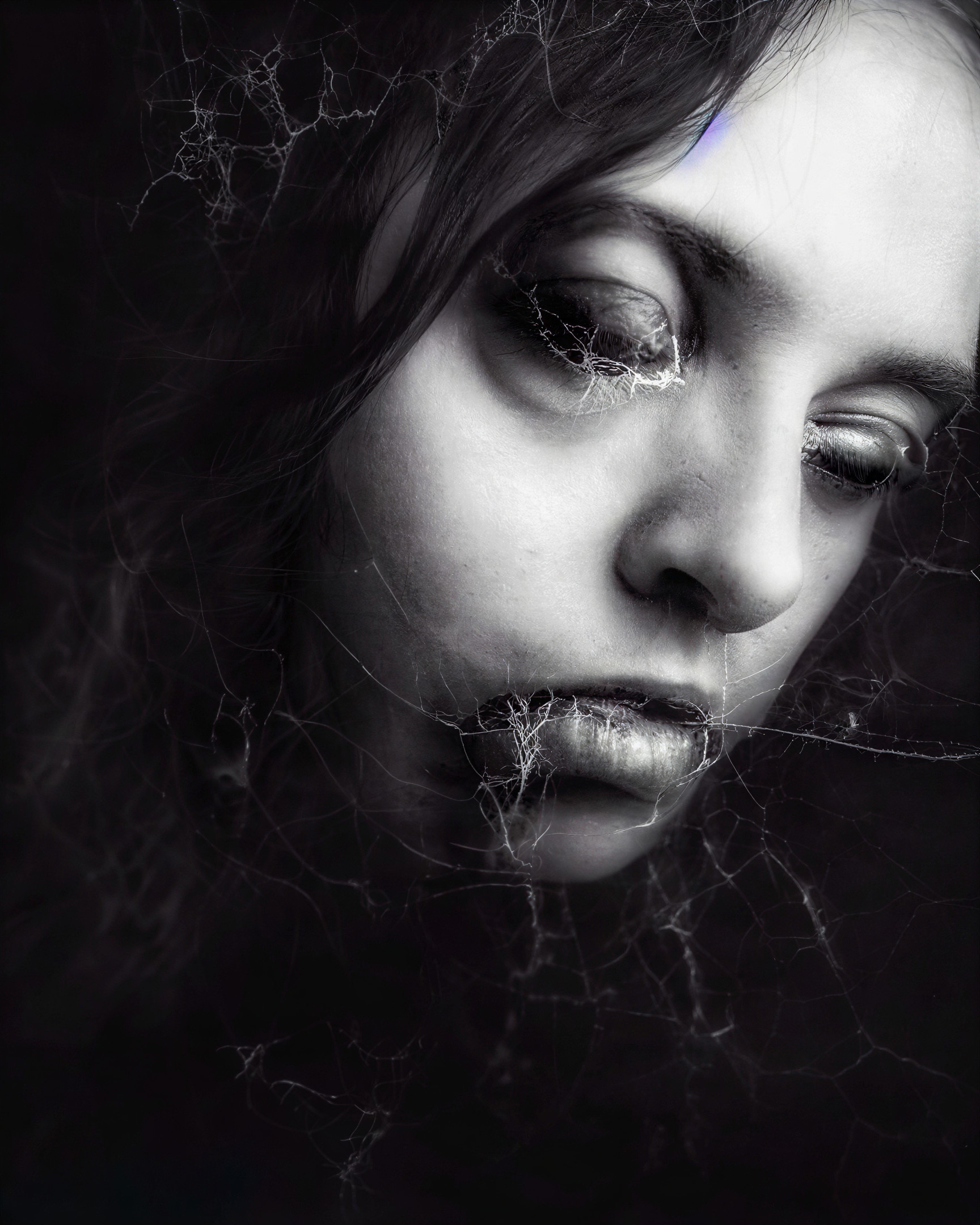 Ethereal Portrait of a Young Woman with Spiderwebs