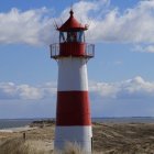 Woman in vintage dress on rural path with landscape view