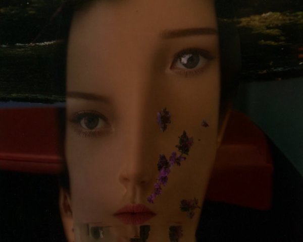 Serene Face Reflection in Water with Floral Elements
