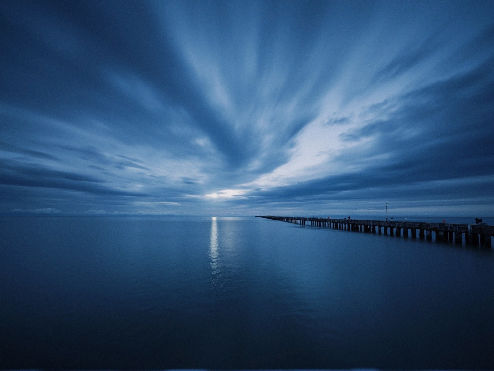 Twilight Seascape with Reflective Waters and Pier