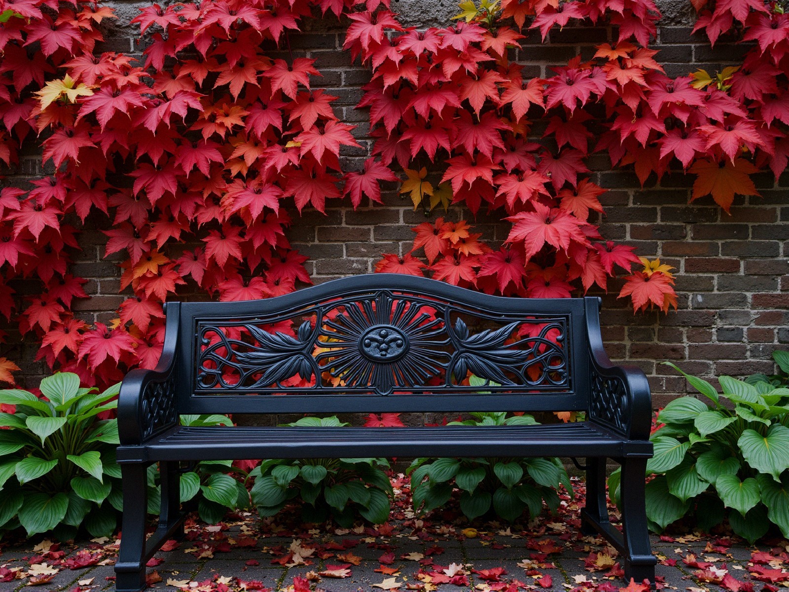 Black Bench Against Vibrant Autumn Foliage and Brick Wall