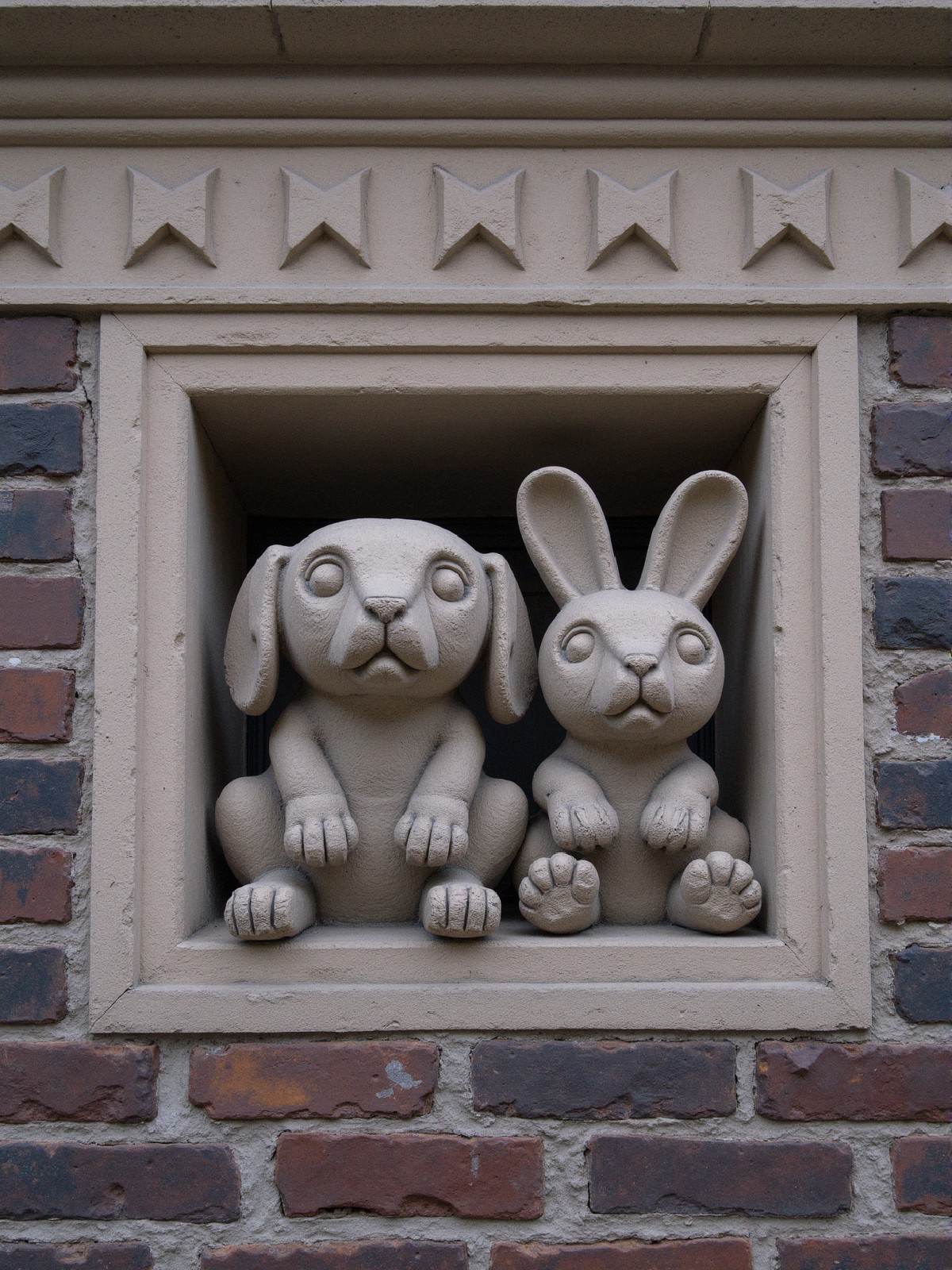 Textured Stone Relief of Cartoon Animals in Window