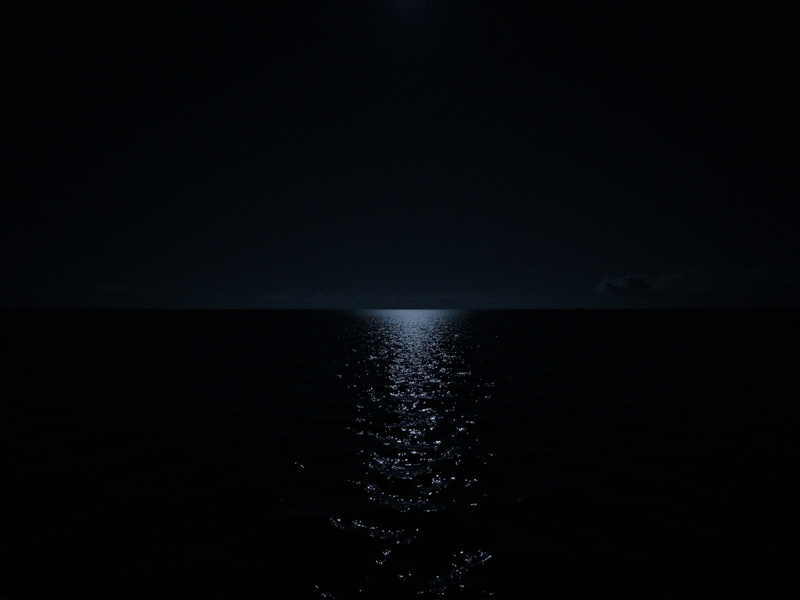Nighttime Seascape with Moonlit Ocean Reflection