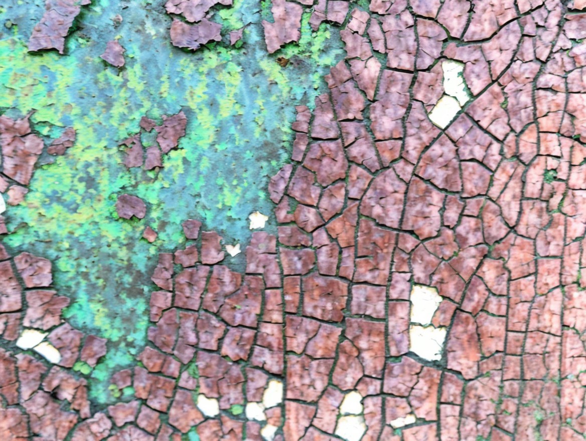 Textured Surface with Cracked Paint in Rustic Colors