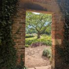 Rustic Stone Window Framing Vibrant Autumn Scene
