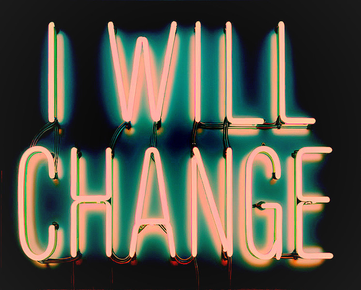 Neon Sign Displaying "I WILL CHANGE" in Bold Letters