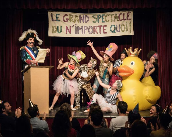 Performers in Costumes with Inflatable Rubber Duck Display