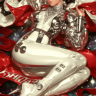 Futuristic Character in White Outfit Against Cosmic Backdrop