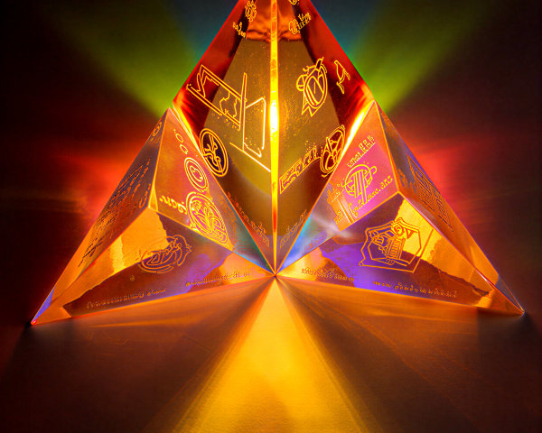 Translucent illuminated pyramid with intricate engravings