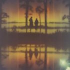 Twilight Lake Scene with Silhouetted Figures
