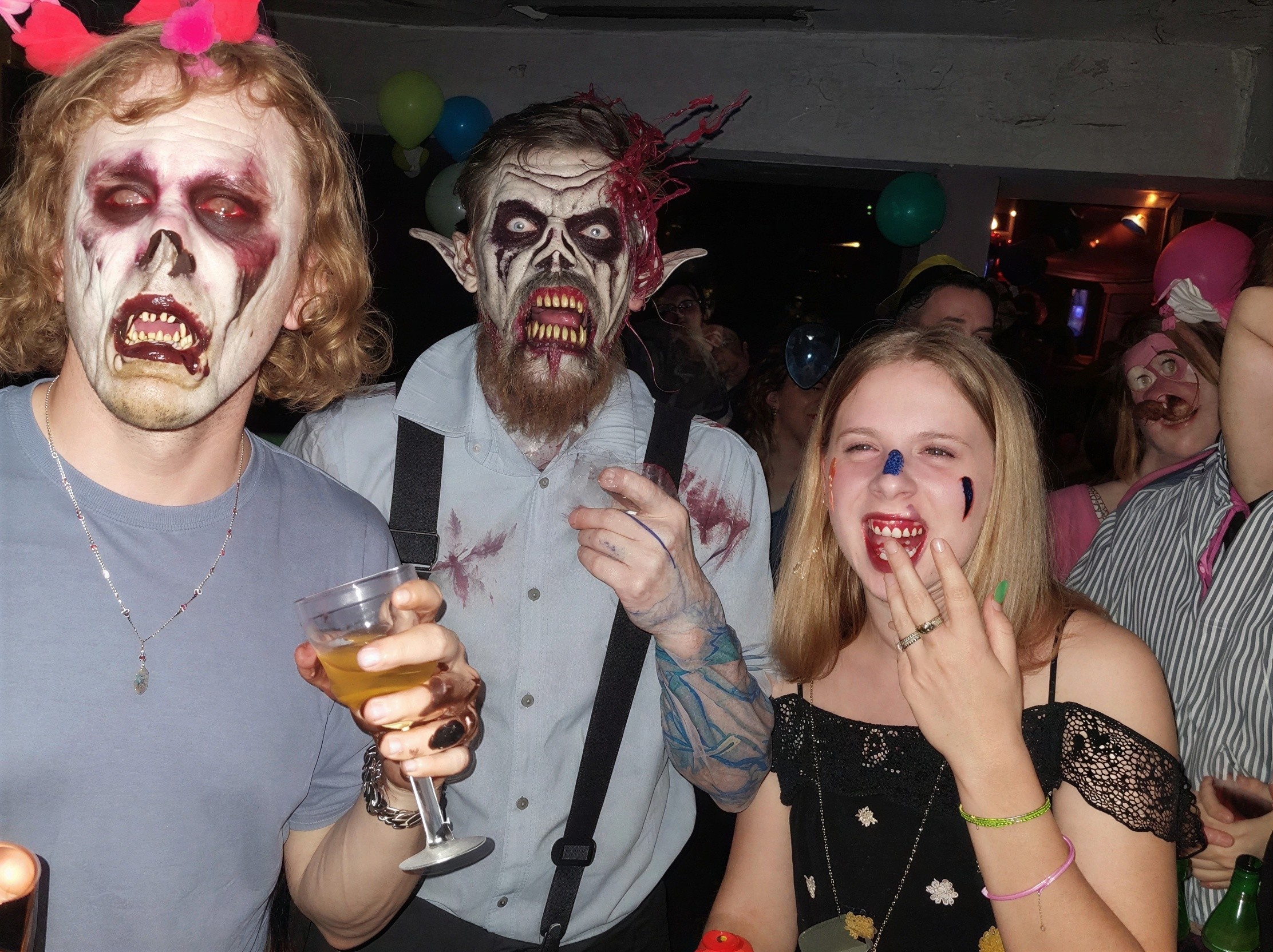 Costume Party Close-Up of Three Individuals