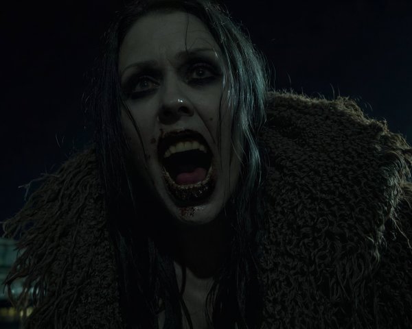 Close-Up of a Female Zombie Vampire in Terror