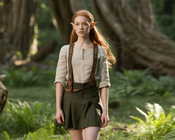 Young woman with pointed ears in a forest setting