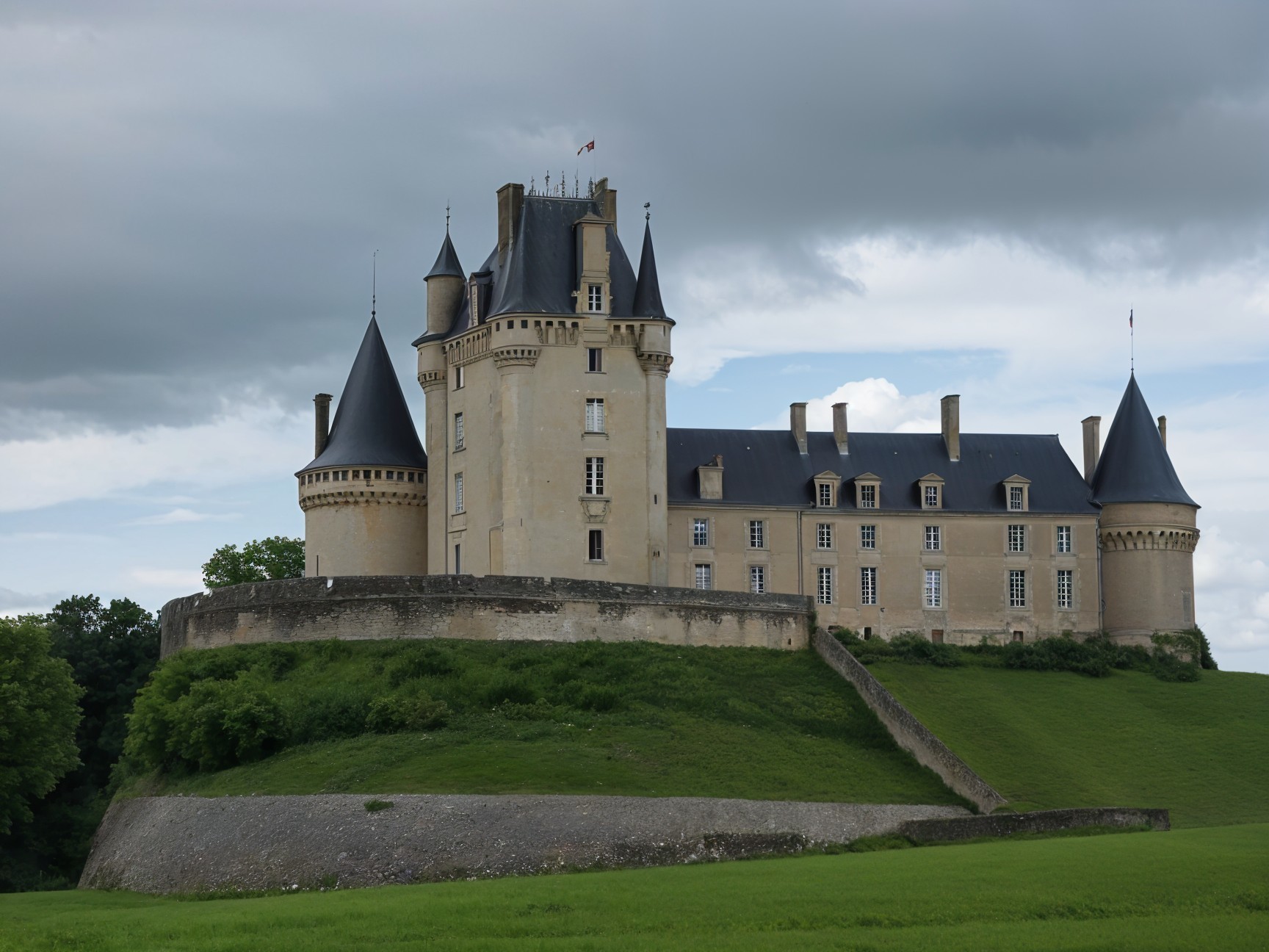Majestic castle on a grassy hill with lush greenery
