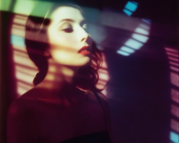 Portrait of a Woman with Colorful Light Patterns