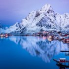Winter Landscape with Snow-Capped Mountains and Lake