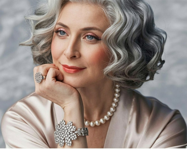 Close-up of a mature woman with gray curly hair