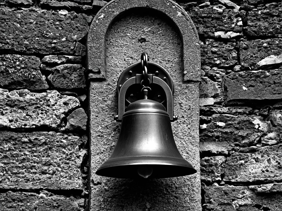 Vintage Bell on Textured Stone Wall Background
