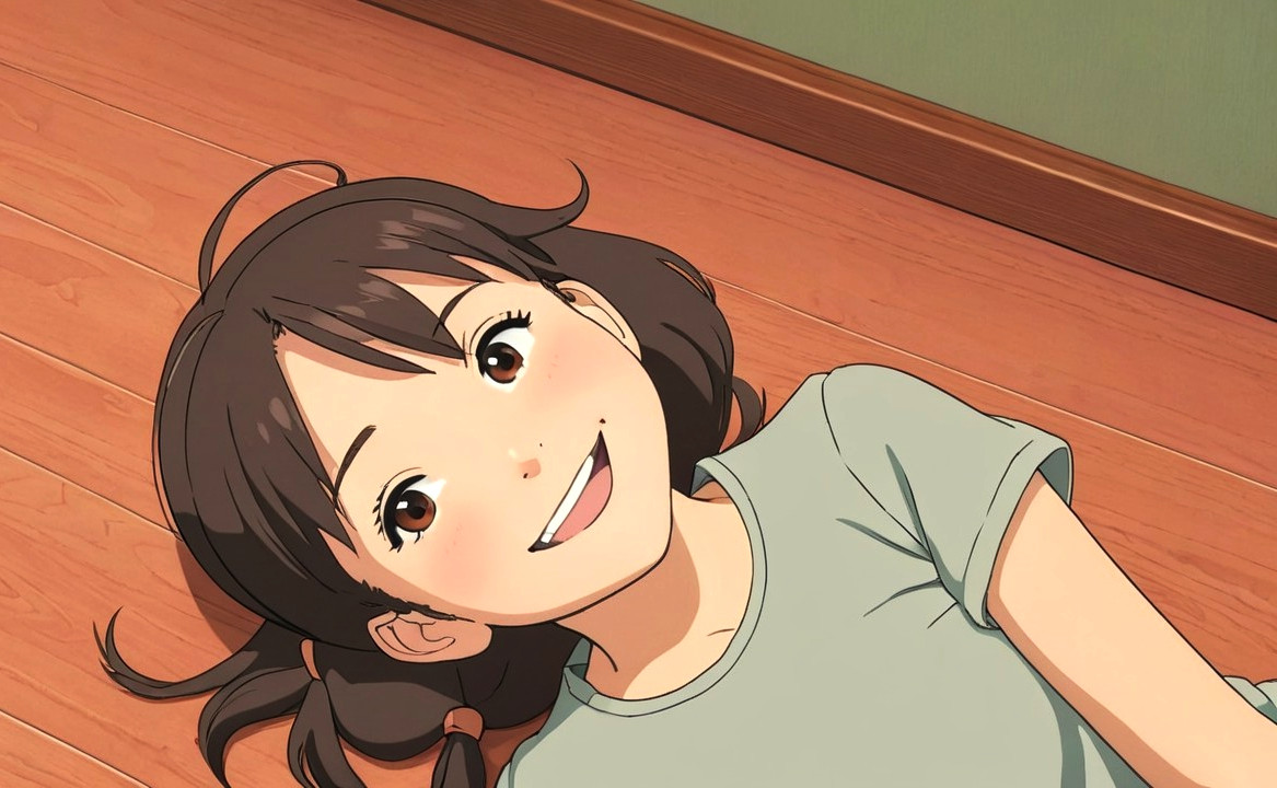 Cheerful girl with dark hair on a wooden floor