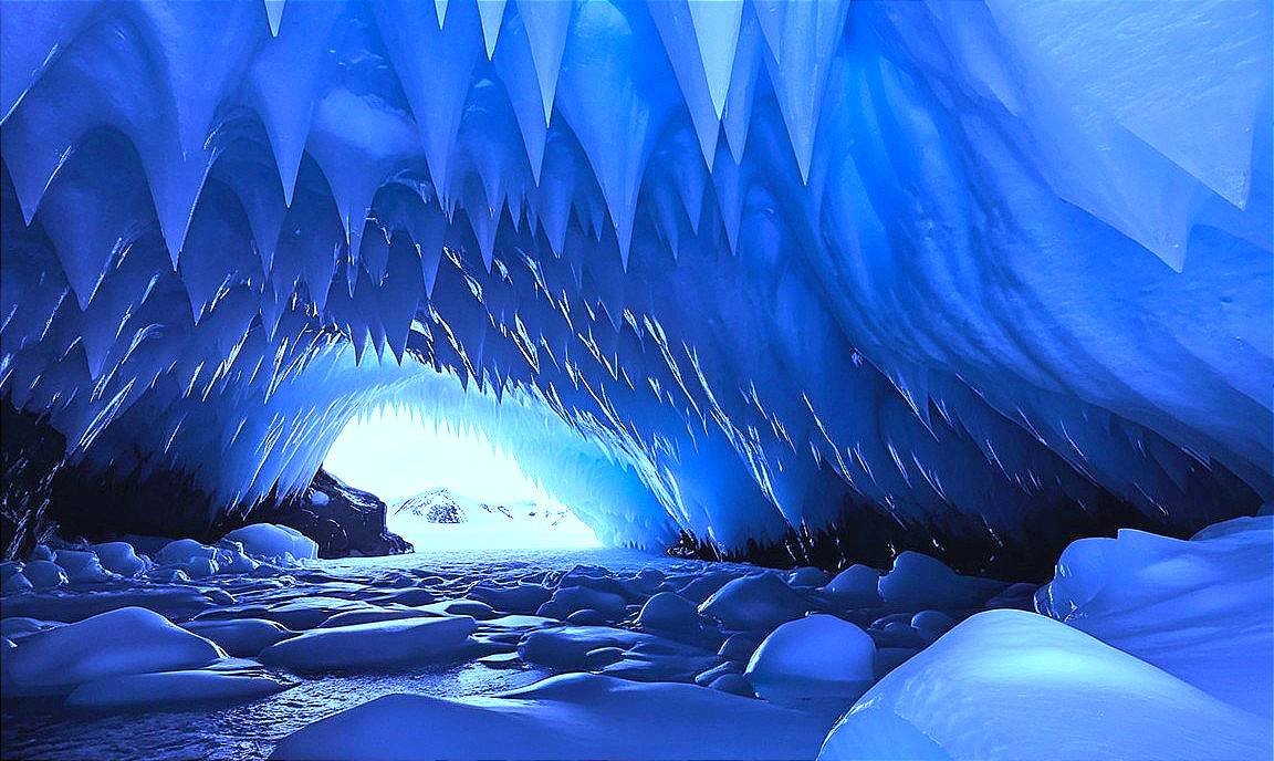 Icy Cave with Blue Ice Formations and Icicles