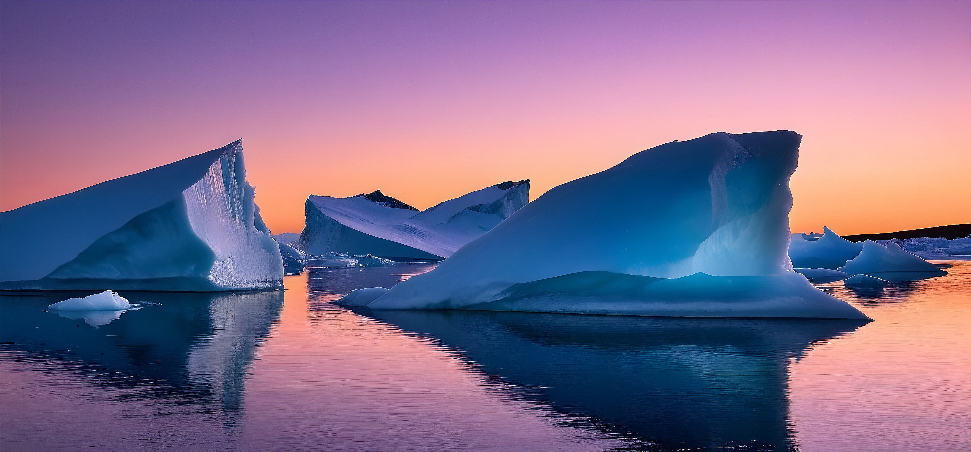 Blue-and-white Icebergs at Sunset Over Calm Water