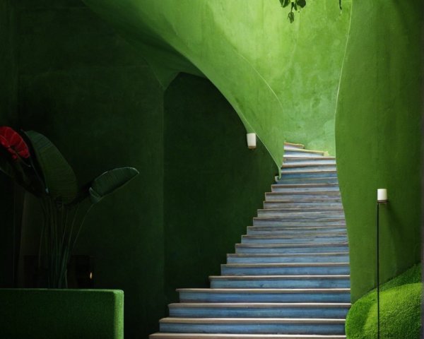 Vibrant Indoor Space with Green Palette and Curved Walls