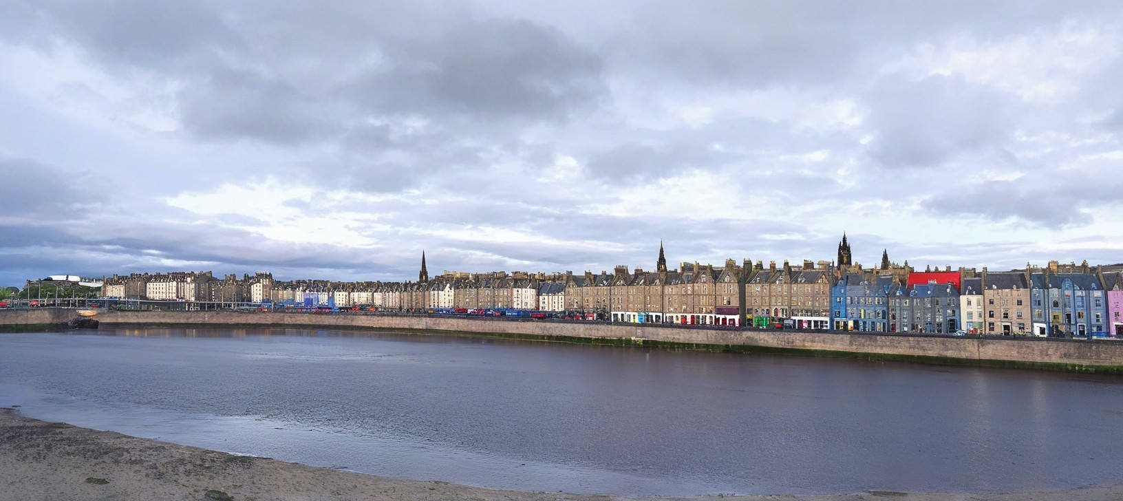 Panoramic View of River and Ornate Building with Cars
