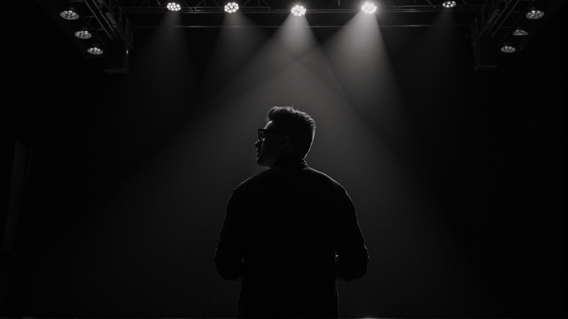 Silhouette in Dark Space with Stage Lights and Shadows