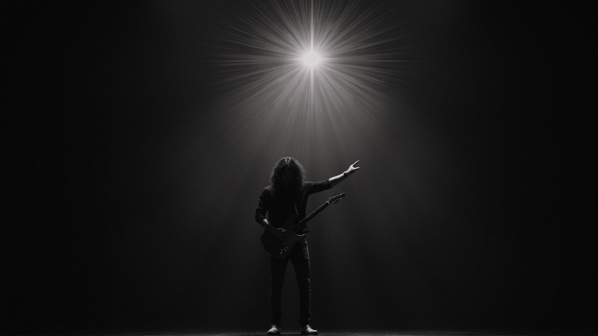 Silhouetted Musician on Stage with Dramatic Lighting