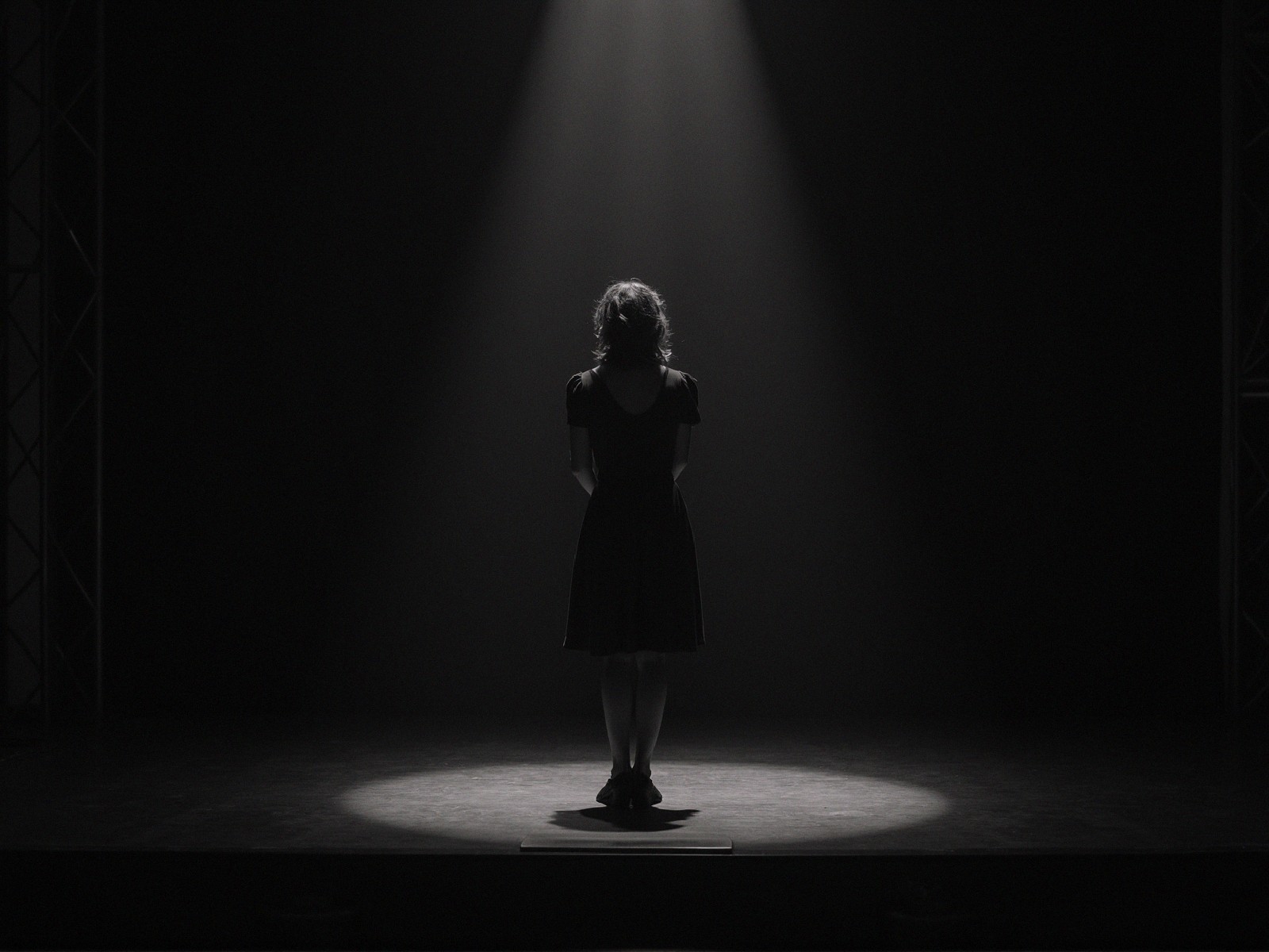 Solitary Figure in Dim Light Reflects Isolation