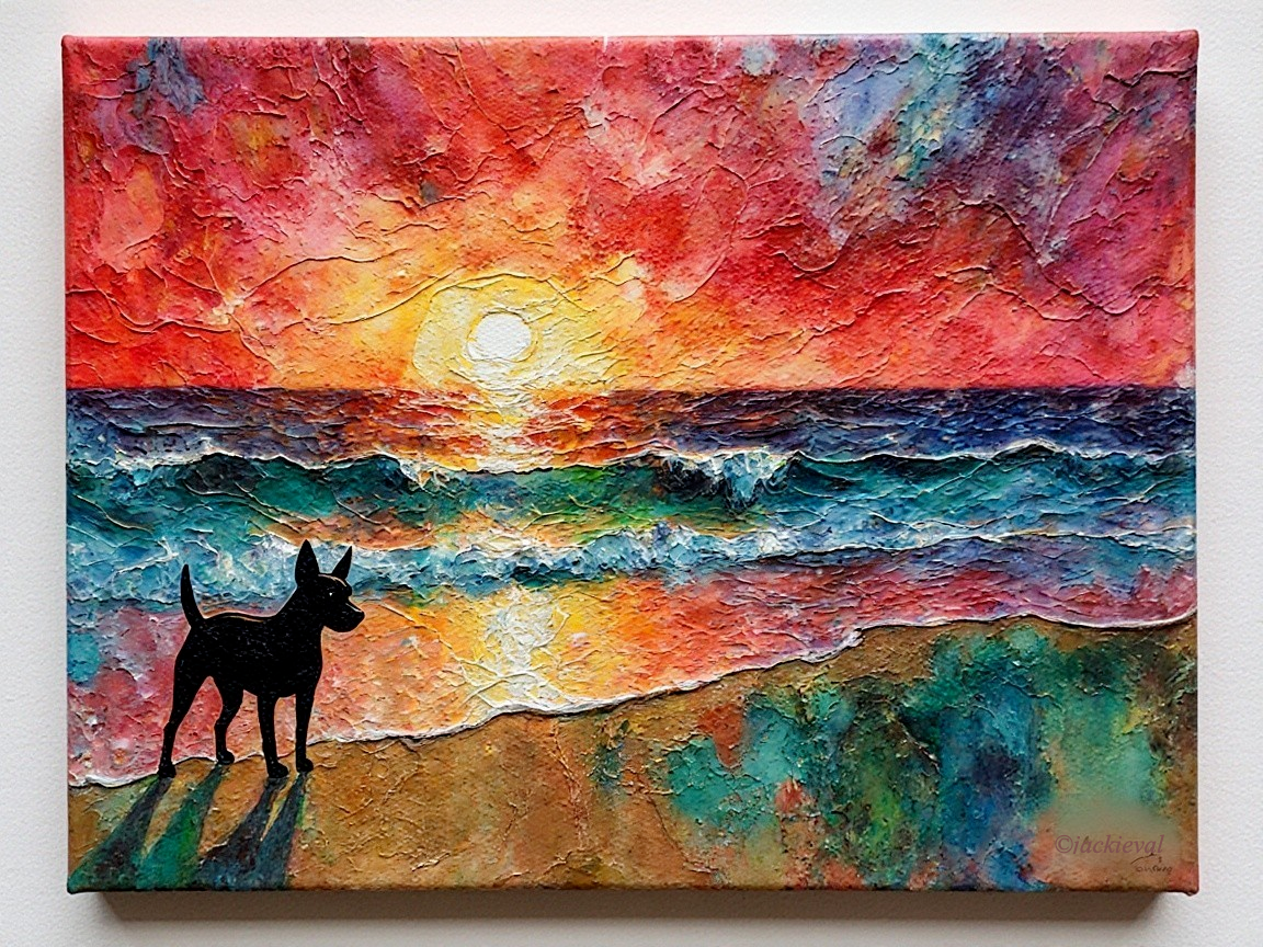 Vibrant Sunset Over Ocean with Dog Silhouette on Beach