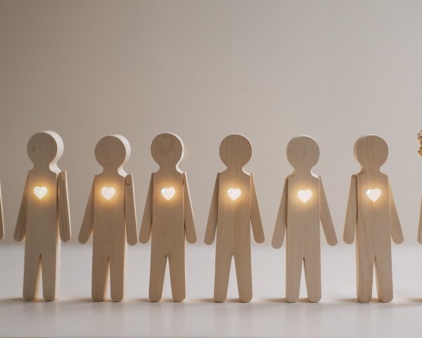 Wooden Figurines with Heart Cutouts and Crown Design