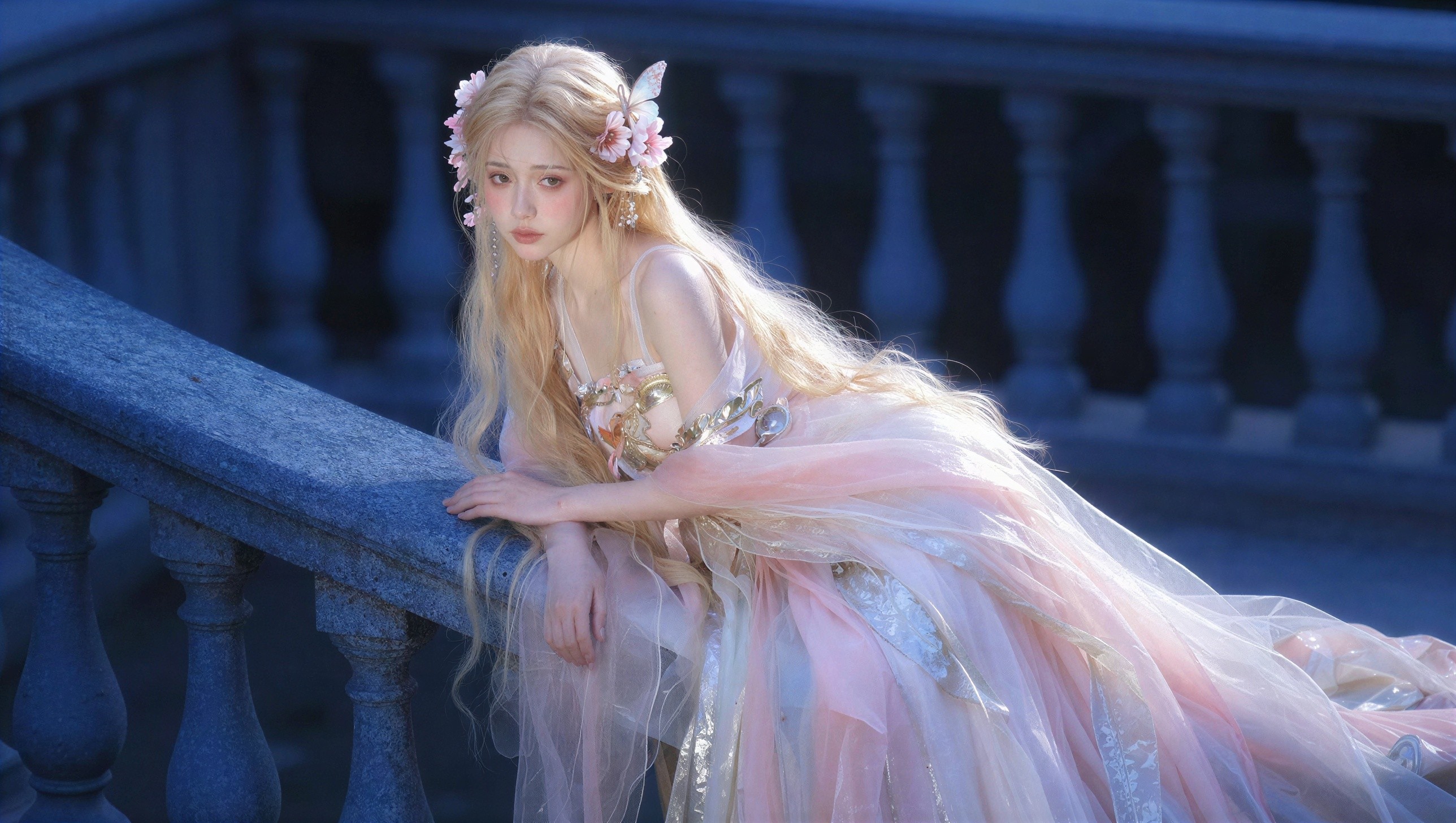 Woman in Ethereal Gown with Floral Hair Accessories