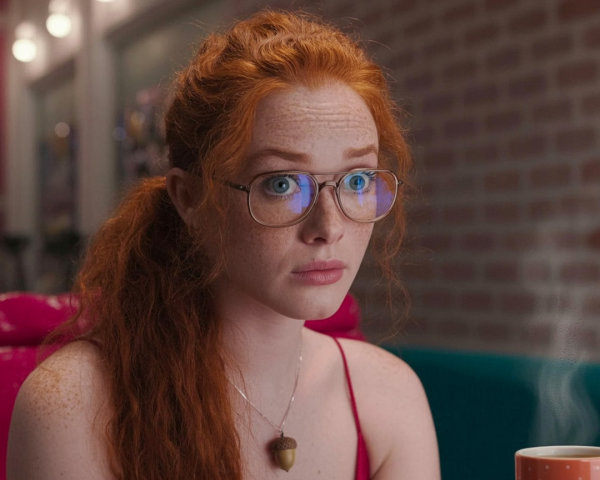 Young woman with red hair in cozy café setting