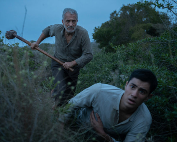 Tense Scene of Two Men in a Grassy Landscape