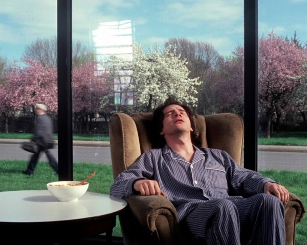 Man Relaxing in Cozy Sunlit Room with Cereal