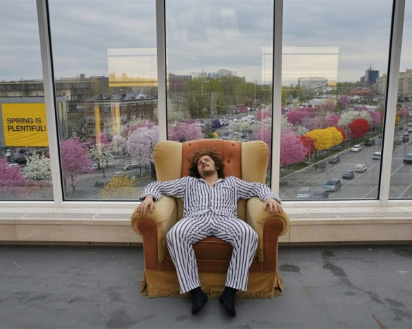 Man in Striped Pajamas Relaxing in Vintage Armchair