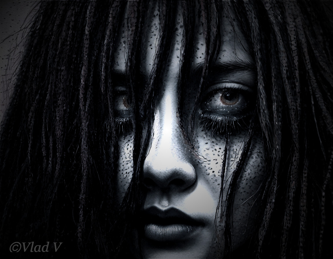 Close-up of a mysterious face with dark hair and makeup