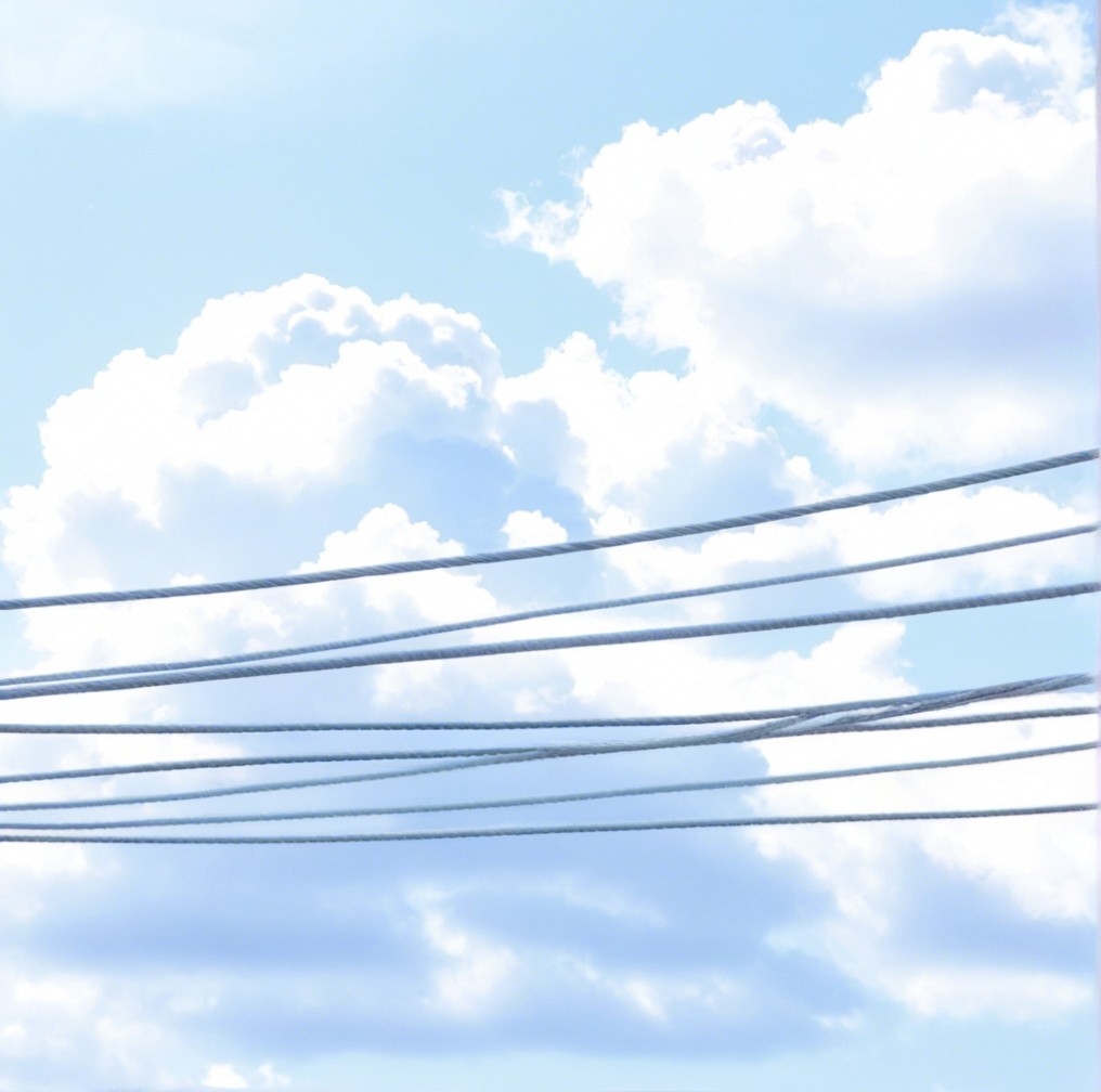 Serene Sky with Fluffy Clouds and Power Lines