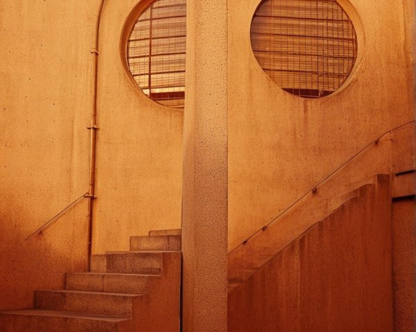 Architectural Design with Earthy Tones and Circular Windows