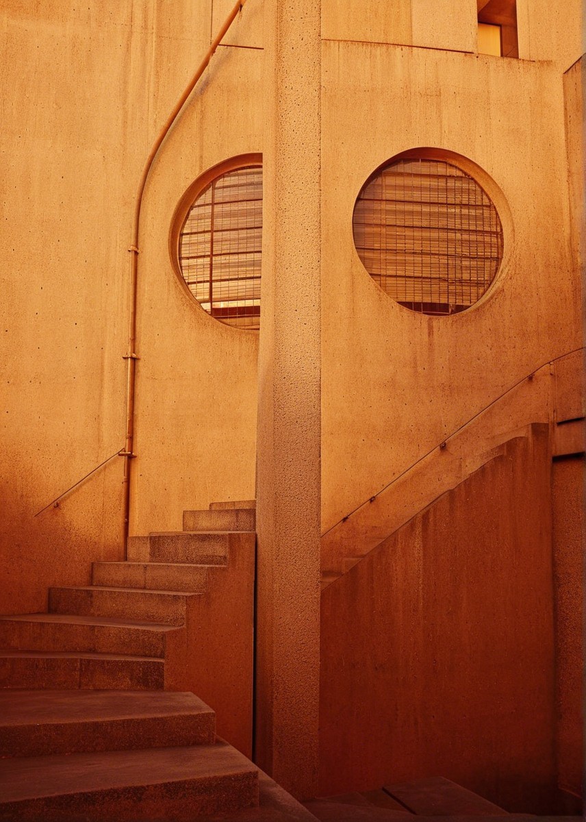 Architectural Design with Earthy Tones and Circular Windows